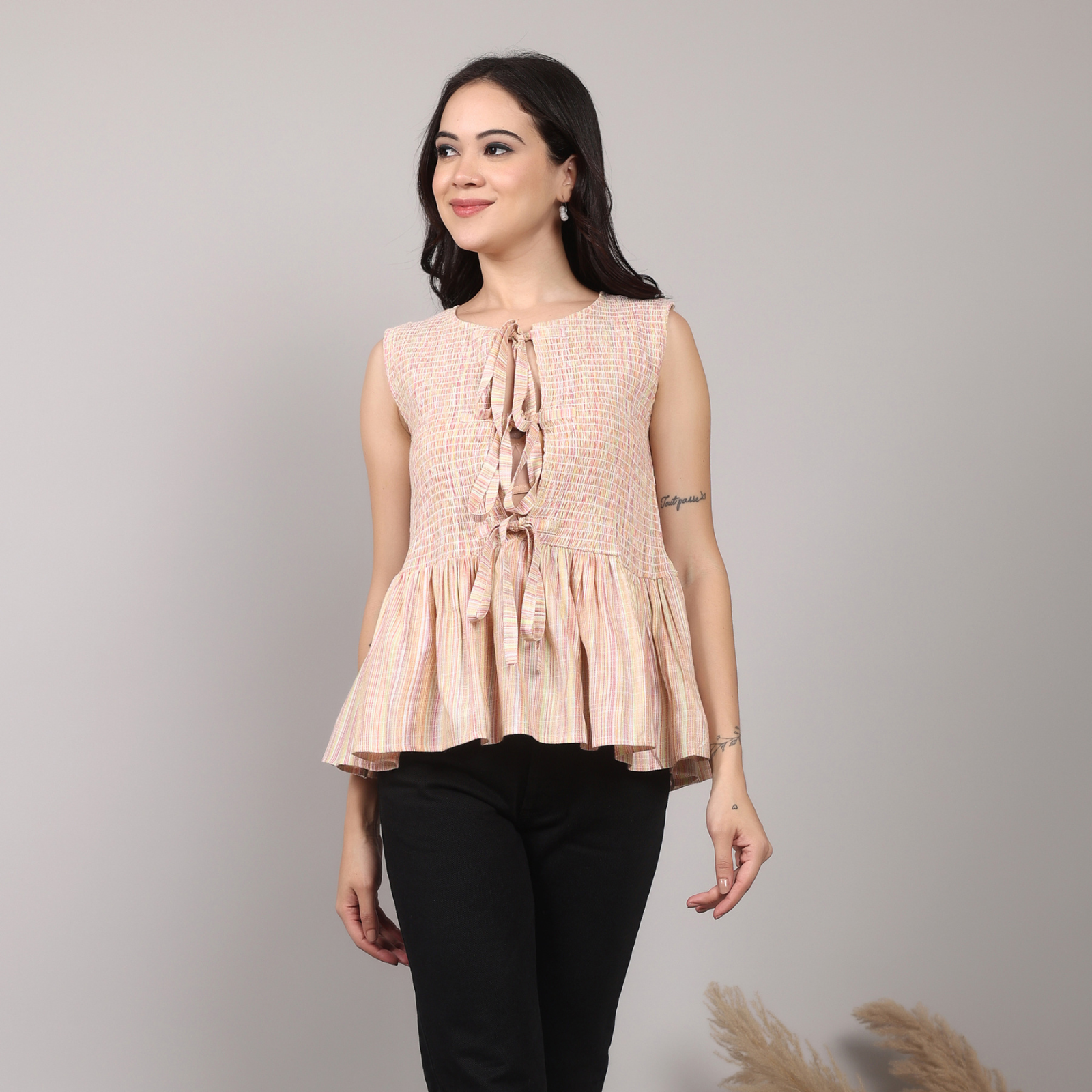 Insaneful New and Now – woman in sleeveless beige cotton tie-front dress, latest arrivals.