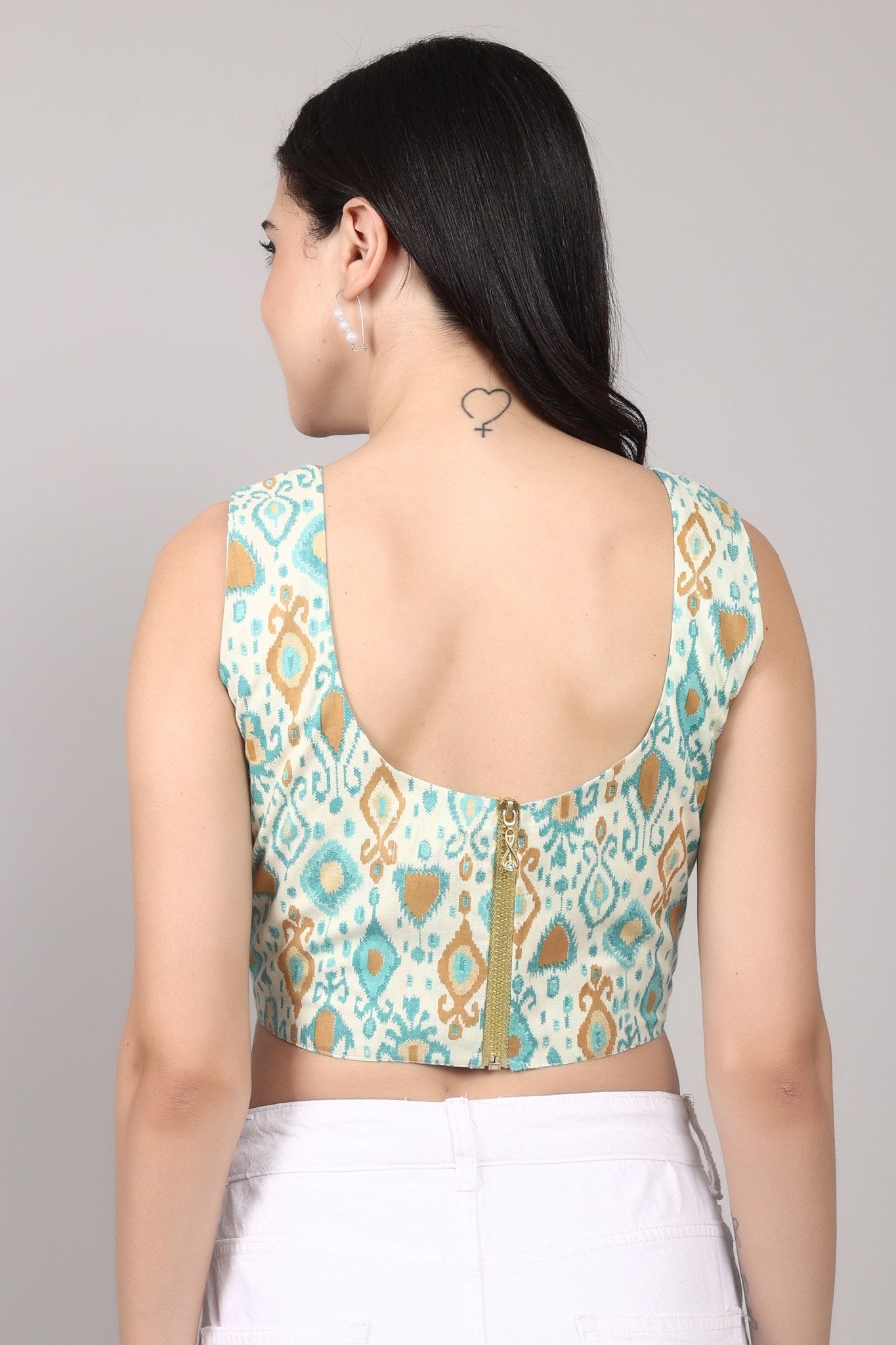 Sleeveless cream corset top with aqua blue and mustard ikat print, square neckline, deep U back, and fitted waist in cotton fabric