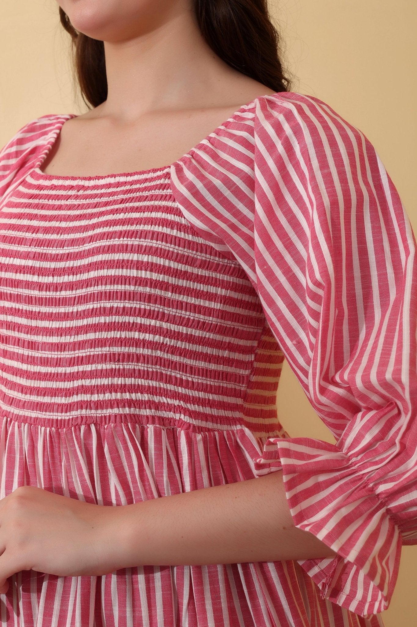 Berry Breeze - Pink and white striped mini dress in 100% cotton with smocked bodice, puffed short ruffle-trimmed sleeves, and a flared tiered skirt for a playful fit-and-flare silhouette.