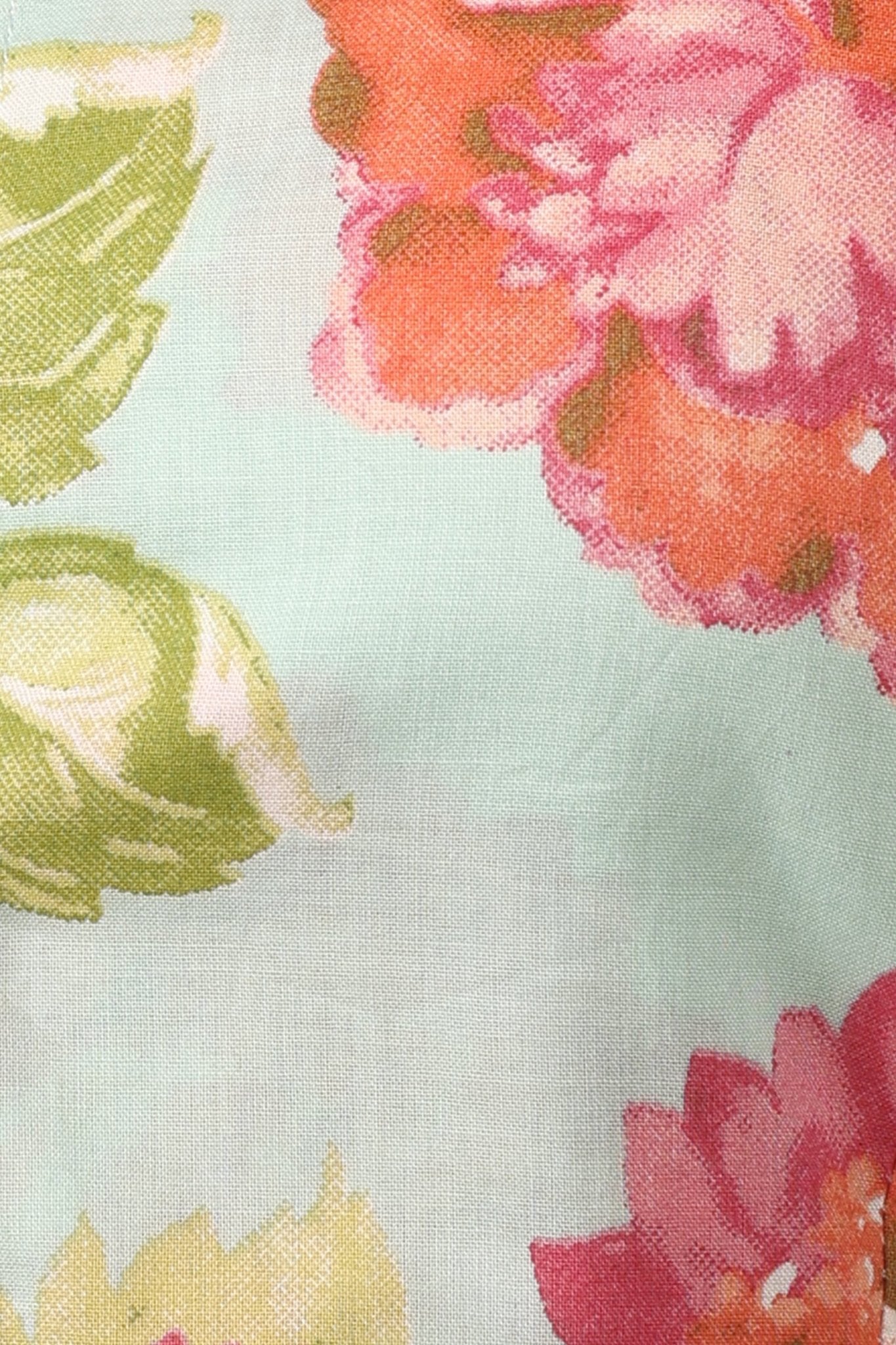 Sleeveless mint green 100% cotton peplum top with vibrant pink and orange floral print, wide straps, sweetheart neckline, button-down front, and ruffled hem