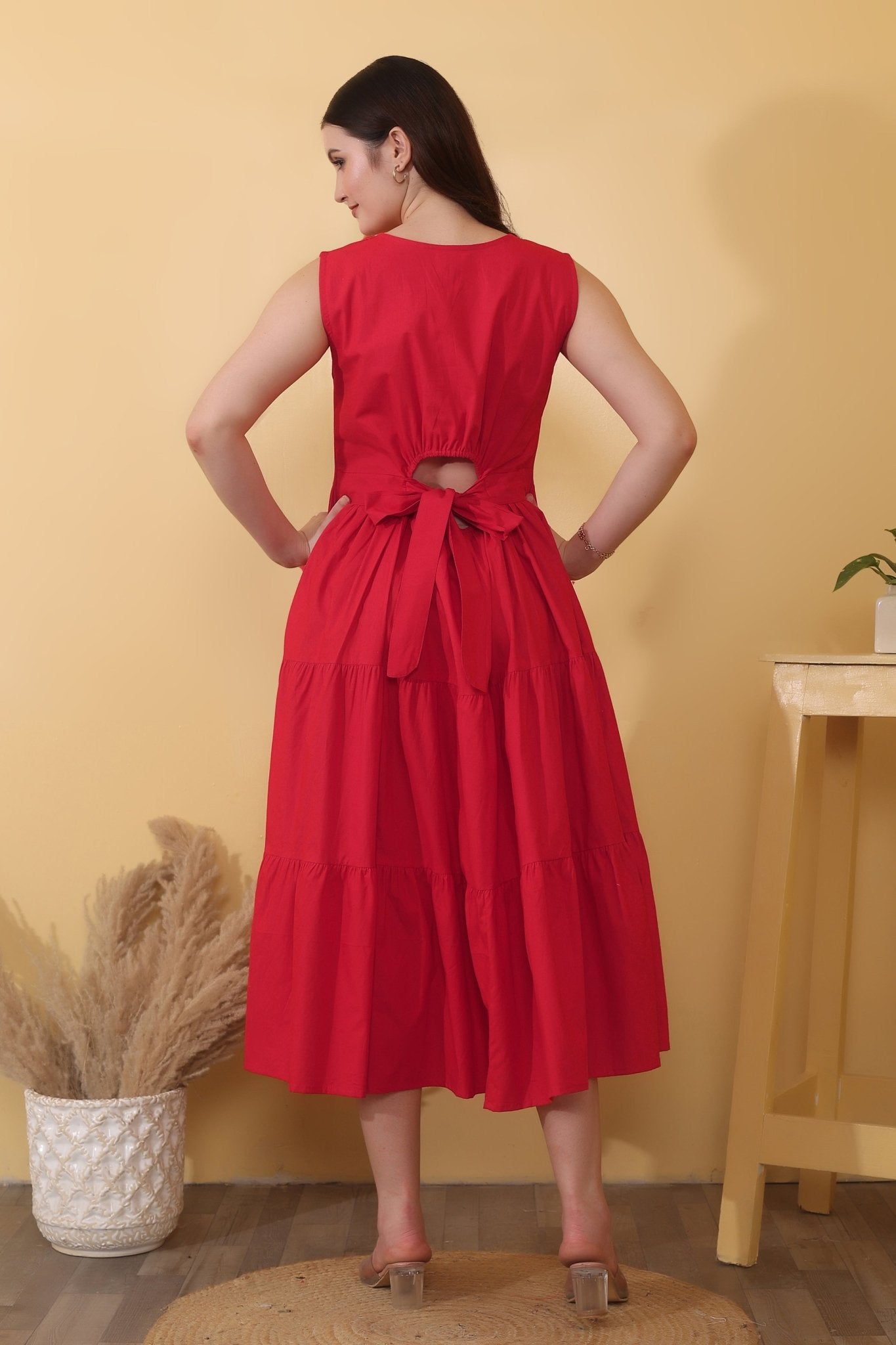 Scarlet Whimsy - Bold red cotton poplin dress with sleeveless fit-and-flare shape, tiered hem, and a dramatic open back detailed with a tie-up bow closure.