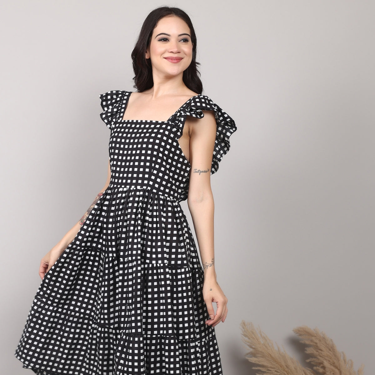 Insaneful Midnight Grid – women’s black and white checkered cotton midi dress with tiered silhouette and ruffle sleeves, styled for versatile everyday and evening looks.